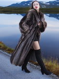 High End Canadian Raccoon Fur Coat with thick collar and cuffs, modeled beside lake, perfect for elegant cold-weather fashion.