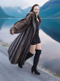 High End Canadian Raccoon Fur Coat styled with black outfit, worn beside lake, perfect for luxury winter fashion enthusiasts.