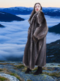 Canadian Raccoon Fur Coat S/M 48" long, worn in high-altitude setting with clouds below, showcasing premium fur outerwear.