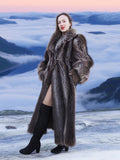 High End Canadian Raccoon Fur Coat in silver tips, styled with thigh-high boots in snowy mountain setting, luxury winter fashion.