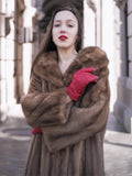 Model wearing vintage pastel Canadian brown mink fur coat with red gloves, showcasing plush collar and premium mink fur detail.