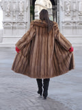 Back view of vintage pastel Canadian brown mink fur coat flared open, showcasing full fur volume and elegant craftsmanship.