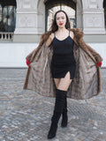 Open vintage pastel Canadian brown mink fur coat revealing satin lining, styled with black mini dress for chic winter layering.