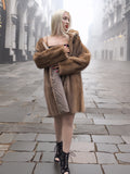 Model wears classic pastel brown mink fur coat stroller jacket M/L off-shoulder. Stylish and warm vintage fur coat for women.