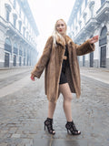 Classic pastel brown mink fur coat stroller jacket M/L styled with black outfit on cobbled street. Elegant and timeless fur fashion.