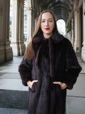 Close-up of La Galleria vintage mink fur coat featuring tie-neck detail and plush mahogany fur, ideal for cold-weather elegance.