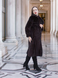 Model in La Galleria vintage mink fur coat with tie closure, showcasing rich mahogany fur and full-length silhouette for winter fashion.