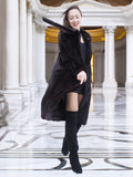 Flowing La Galleria mahogany mink fur coat with satin lining, styled with black mini dress and boots for chic winter fashion.