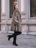 Model turning in Two Tone Mink Fur Jacket L/XL 16, showcasing the jacket’s elegant drape and luxurious fur finish.