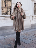 Model walking in Canadian Mink Fur Jacket L/XL 16, styled with black boots and a mini dress for a high-end winter look.