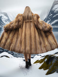 Back view of vintage red fox coat in snowy valley