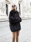 Unisex Dark Mahogany Mink Fur Bomber Jacket Coat M/L styled in front of historic architecture, showcasing its elegant, voluminous design.