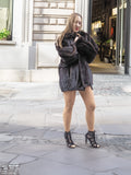 Unisex Dark Mahogany Mink Fur Bomber Jacket Coat M/L styled with black heels, highlighting its luxurious texture and flattering fit.