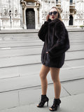 Side profile of Unisex Dark Mahogany Mink Fur Bomber Jacket Coat M/L, styled with sunglasses and heels for a chic city look.