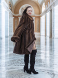 Model turning in Brand New Luxurious Demi Buff Swing Canadian Mink Fur Coat L/XL, showcasing its rich demi buff color and satin lining.