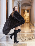 Black mink luxury coat in motion, showcasing full-length fur and dramatic flair, ideal for cold-weather glamour and opulent winter outerwear.