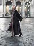 NAFA female black mink coat with indigo fox collar and sleeves in L/XL, styled outdoors with elegant black boots for winter fashion.
