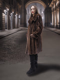Model in dark brown vintage mink fur coat standing under arches, highlighting timeless elegance in outerwear fashion.