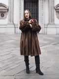 Front view of woman in dark mahogany mink fur coat, styled for medium size in elegant vintage outerwear fashion.