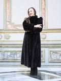 Full-length black mink fur coat with structured shoulders and plush texture, styled in a classic interior. Elegant cold-weather fashion, size M.