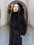 Close-up of black mink fur coat with high collar and plush finish, perfect for elegant winter fashion. Premium fur outerwear, size M.