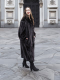 Model wearing a full-length black mink fur coat with a soft sheen, perfect for upscale winter outerwear fashion.