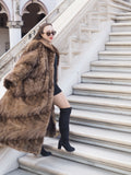 Espresso Mink Long Coat - Regal Swing styled on marble stairs, paired with black mini dress and boots for luxury outerwear appeal.