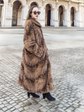 Espresso Mink Long Coat - Regal Swing from the side, showing full-length mink fur and elegant swing silhouette in cobblestone plaza.