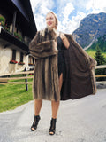 a woman in a fur coat posing for a picture