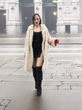Beige Mink Fur Coat - Vintage Luxury worn over black mini dress. Elegant outerwear for upscale winter styling.
