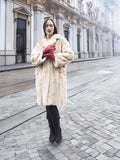 Beige Mink Fur Coat - Vintage Luxury in front of historic building. Medium size fur coat for timeless winter elegance.