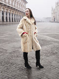 Vintage Beige Pearl Mink Fur Coat S/M with hands in pockets. Luxurious mink fur coat for stylish winter wear.