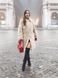 Vintage Beige Pearl Mink Fur Coat S/M styled with thigh-high boots. Elegant and warm outerwear for city strolls.