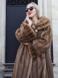 Luxurious Canadian brown mink fur coat with stroller silhouette, modeled in a stylish setting.