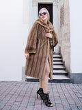 Elegant vintage-style Canadian mink fur coat, worn by fashionable woman standing on steps.