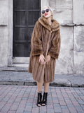 Elegant fur coat, vintage style, worn by woman, standing outdoors, sunglasses, stylish fashion accessory.