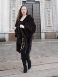 Model walking in XL/XXL mahogany mink swing coat with gold baroque lining. Real fur outerwear for stylish winter elegance.