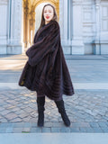 Mahogany mink swing coat XL/XXL with flared hem and soft texture. Elegant fur fashion for upscale winter wardrobes.