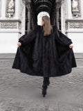 Back view of flowing dark ranch mink fur coat in motion, highlighting natural fur elegance and winter outerwear appeal.