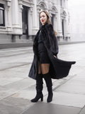 Stylish black mink fur coat paired with thigh-high boots, perfect for chic winter fashion and luxury outerwear.