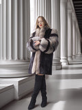 Woman wearing a patterned fur coat in a classical architecture setting