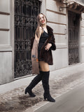 Pre-owned Majestic Opera Mink coat with visible label, styled with a black mini dress and boots for chic cold-weather fashion.