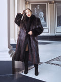 Woman wearing a fur coat in an elegant interior setting