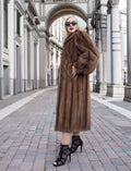 Elegant vintage Canadian brown mink fur coat, silk-lined, stylish woman posing in city street