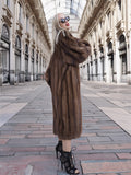 Luxurious vintage Canadian brown mink fur coat with silk lining, showcased in a grand indoor shopping gallery.