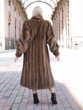 Vintage pastel Canadian brown mink fur coat with silk lining, showcased in a grand archway setting.