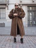 Luxurious vintage brown mink fur coat with silk lining, showcased on city street.