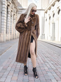 Luxurious brown mink fur coat with silk lining, worn by a fashionable woman in a city setting.