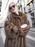 Elegant vintage Canadian brown mink fur coat with silk lining, showcased by a stylish woman on the city street.