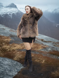 Raccoon Glamour Jacket - Mountain Mirage S/M styled in tundra setting, showcasing full-length fur texture and premium winter outerwear.